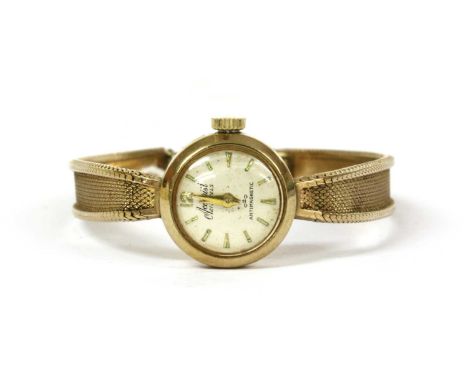 A ladies' 9ct gold Accurist mechanical bracelet watch, 16mm diameter with a silvered dial and baton hour markers, 12 jewel ma