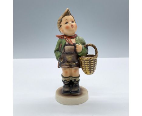Hand painted in matte finish modeled as a young German boy carrying a basket. Goebel Hummel backstamp. Issued: 20th centuryDi