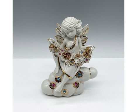 Lovely figural adorned with Swarovski crystal and gilt accents. RG impressed mark. Capodimonte mark. This item has its origin