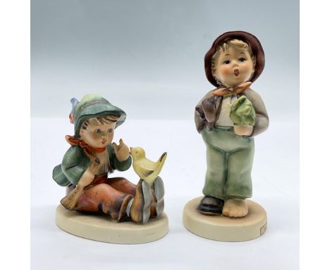 Features porcelain figurines of a seated boy with a with perched on his shoes and a boy wearing only one shoe and holding an 