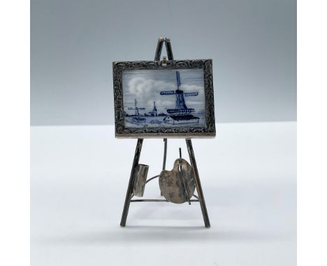 Adorable hand painted porcelain featuring a blue scene of Dutch windmills mounted on metal frame and miniature easel. Signed.
