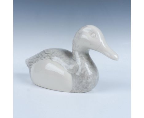 Graceful glazed ceramic duck with grey and white coloration. Dimensions: 12"L x 4.25"W x 6"HCondition: Age related wear.