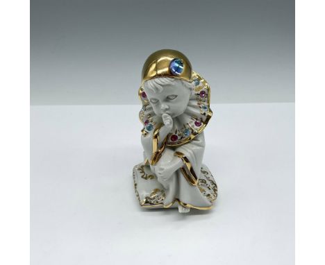 Lovely design of baby figural seated on pillow dressed in clown attire, which is adorned with Swarovski crystals and gilt edg