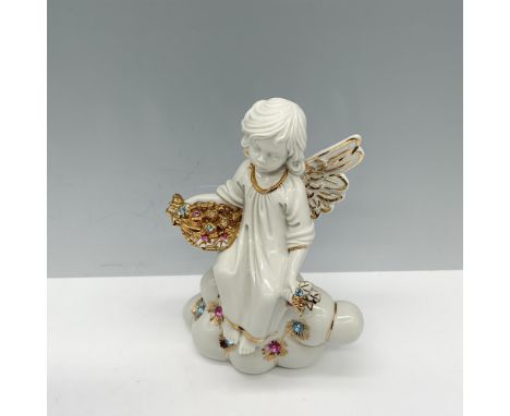 Splendid white porcelain figure of a Swarovski decorated winged young girl sitting on a cloud as she holds a tray with gilt b