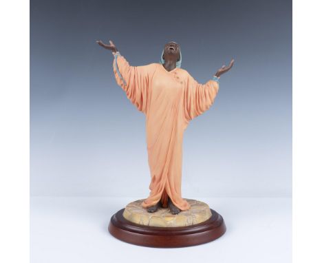 Limited Edition resin figure of an elated woman singing towards the skies as she models a peach colored dress. Thomas Blacksh
