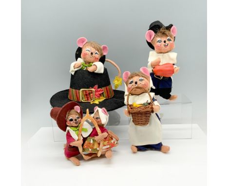 Adorable collection of Thanksgiving decor that consists of a couple holding a wishbone, a mouse holding a gourd, a mouse hold
