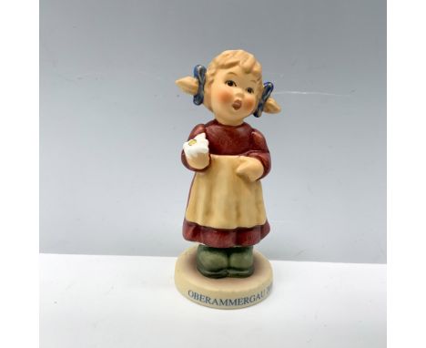 Lovely figure of a young girl holding a freshly picked flower. Goebel backstamp. This item has its original box 3"L x 3"W x 4