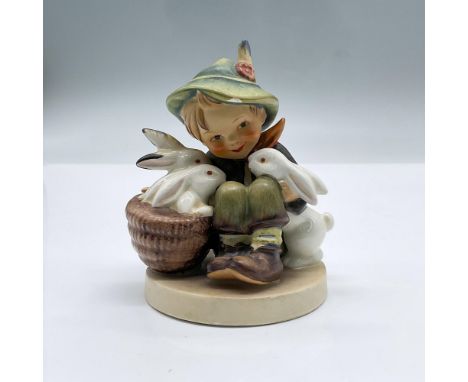Playmates 58/0 features a seated small boy surrounded by three white bunnies. Goebel Hummel backstamp. Issued: 20th centuryDi