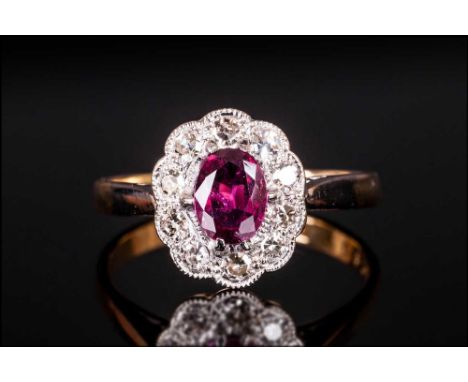 18ct Gold And Platinum Set Ruby & Diamond Cluster Ring, set with 6x4 ruby of good colour and 10-8 cut diamonds. Also of good 