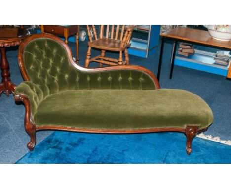 Victorian Style Chaise Lounge Settee with a shaped spoon back and shaped base arm. On carved cabriole legs. button back cover