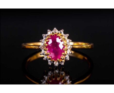 Ruby and White Topaz Ring, a 1.2ct oval cut ruby, of good colour, set in 14ct gold vermeil, with a frame of silver, highlight