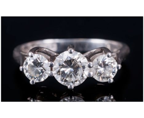 A Platinum Set 3 Stone Diamond Ring, round brilliant cut diamonds, centre stone VS1 - VS2 Clarity, K-L colour.  1.30cts diamo