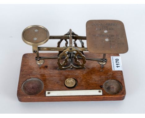 A Set Of Brass Postal Scales by Windle E Blythe. On Oak Base. Weight Missing