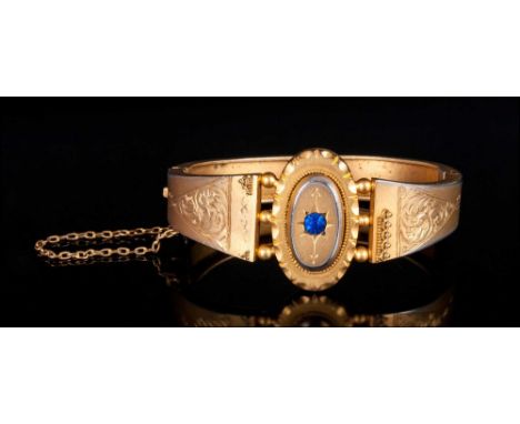 Early Victorian Gilt Metal Hinged Bangle with sapphire set centre & chased decoration to shoulders with safety chain & origin