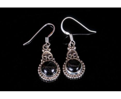 Black Star Diopside Drop Earrings, a pair of round cabochon cut black star diopsides, each displaying asterism in the form of