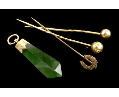 Edwardian 9ct gold horseshoe pin, Chester 1907, two other stick pins tested 9ct and a gold mounted jade pendant, stamped 9ct 