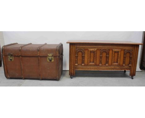 A mid/late 20th century oak panel chest with strap hinges, width 115cm and a Warranted Fluxite Fibre fitted university trunk 