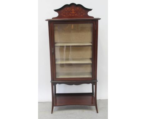 An Edward VII mahogany three-shelf display cabinet on splayed square tapering legs united by a shelf stretcher, height 145cm.