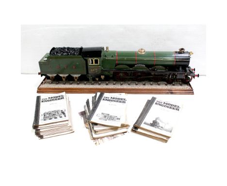 A 2-1/2 inch gauge model steam-fired train and tender, painted in the colours of the Flying Scotsman with plaque 'The Flying 