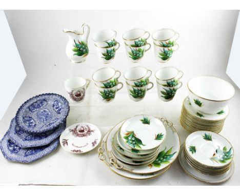 A Scandinavian-style hand painted and printed twelve-setting tea set decorated with snowdrops, comprising twelve cups, twelve