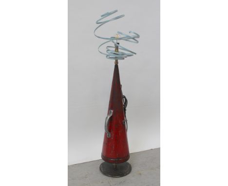 A vintage conical fire extinguisher converted as a table lamp with spiral steel shade, height approx 115cm.