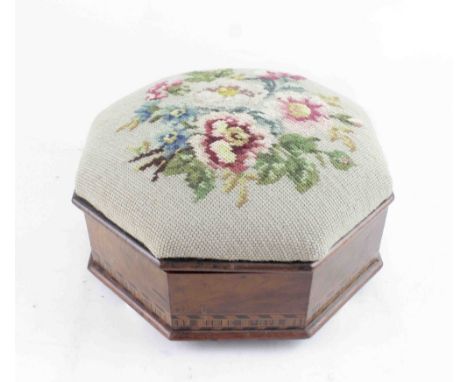 A Victorian walnut octagonal work stool with German bandwork to the bottom, covered in grospoint tapestry floral needlework c