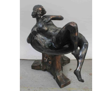 A bronzed metal satyr lamp with recumbent lady peering into a pool, height 56cm.