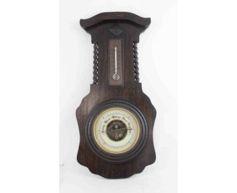A 1930s aneroid barometer with mercury thermometer, the thermometer in beaded mount flanked by barleytwist columns, overall h