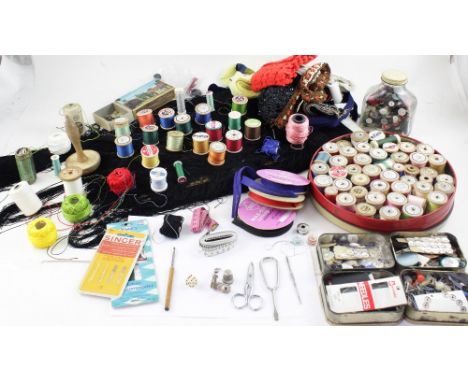 A collection of haberdashery materials to include cotton reels, buttons, sash gimping etc.