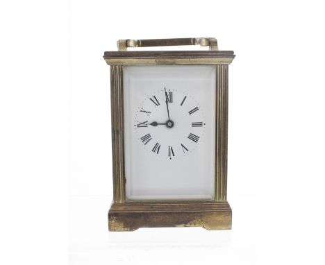 A brass carriage clock, the enamelled dial set with Roman numerals, lacking door handle and key, height 12.5cm.