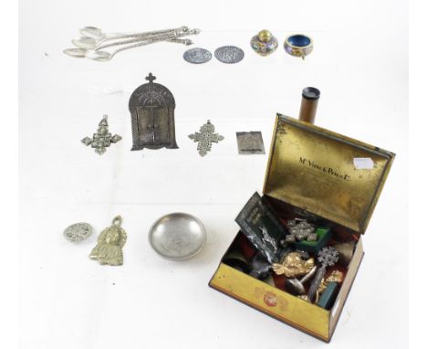 A McVitie &amp; Price Coronation biscuit tin containing various Eastern white metal pendants, spoons, enamel salt and pepper,