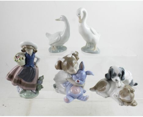 A small mixed group of Nao and Lladró to include a Nao girl with rabbit, two Lladró Nao geese, a Lladró figure of a young gir