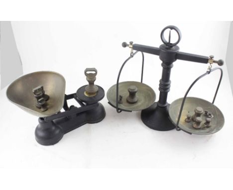 Two sets of brass and iron pan balance scales, one marked 'The Salter Staffordshire', the other a beam scales, height 35.5cm 