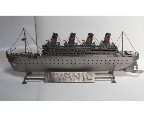 A scratch-built plate iron and copper model of the Titanic, length 80cm, presented on wrought metal stand.