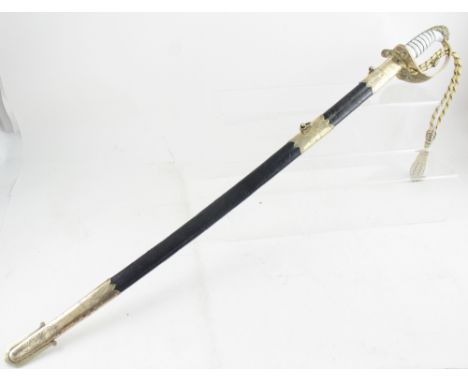 A 19th century naval officer's dress sword with lion terminus or stock and basket hilt decorated with crowned anchor, the bla