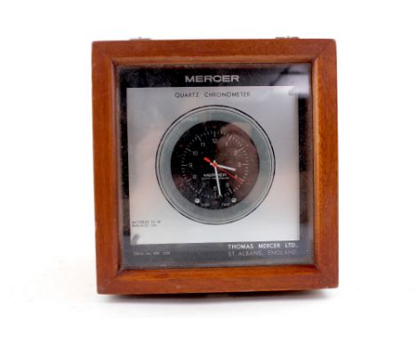 A Mercer Quartz marine chronometer supplied by Thomas Mercer Ltd for Kelvin Hughes, serial number MQ052, presented in mahogan