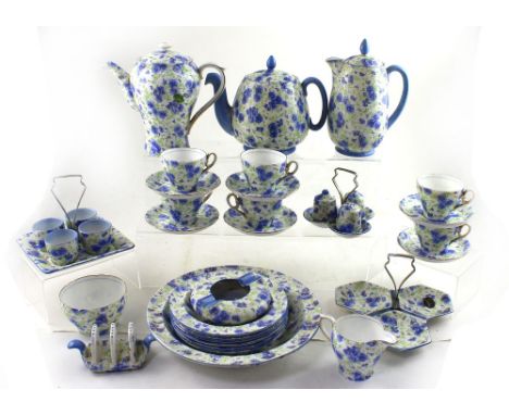 A quantity of c1920s Shelley 'Blue Pansy Chintz' pattern tea and coffee ware to include a teapot, hot water pot, coffee pot, 