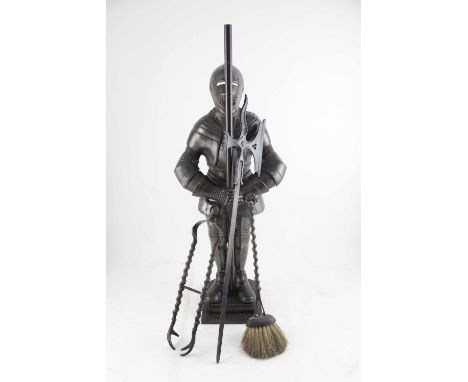 A cast iron suit of armour fire companion set from the model by Harry Banks, registered design number 777765, produced by Nes