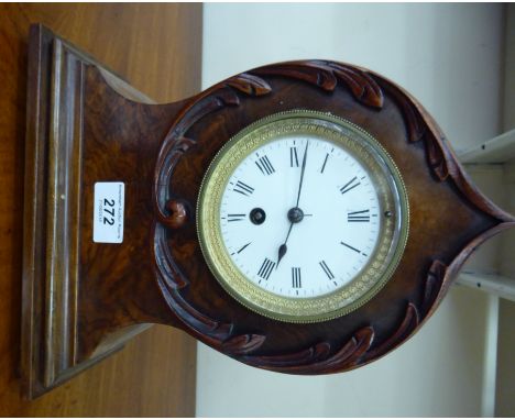 A late 19thC walnut cased mantle clock; the movement faced by an enamelled Roman dial  11''h       CS