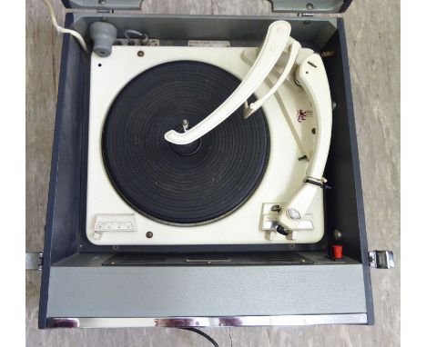 A 1960s Bush record player with a Garrard, model 216 autochange deck, in a two tone charcoal coloured and grey vinyl covered 