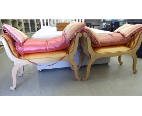 A pair of modern Regency design stained beech window seats, each with a scrolled end, button upholstered in gold coloured fab