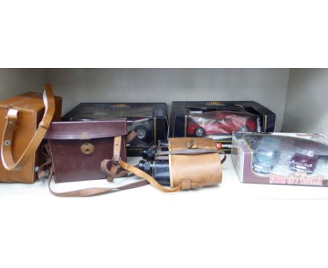 A mixed lot: to include a pair of early 20thC binoculars, model no.20244       S