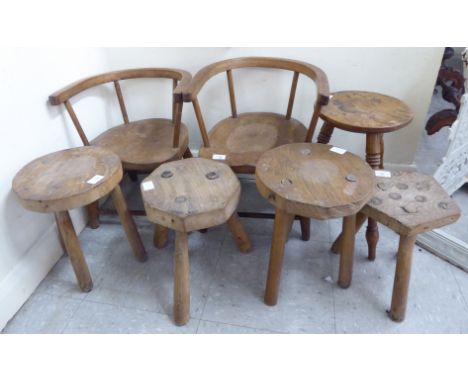 Small furniture: to include a pair of beech and elm framed childrens chairs, the carved backs over a solid seat, raised on ta
