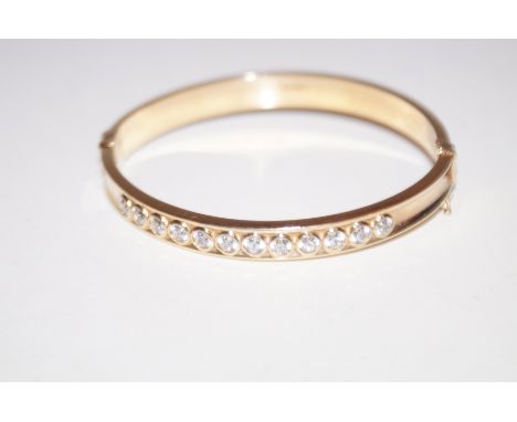 9ct Gold bangle set with 12 stones 