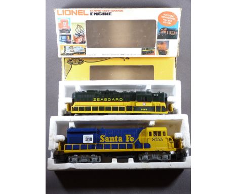 LIONEL ELECTRIC TRAINS O'GAUGE - two boxed engines, Santa Fe livery U36B, Cab No 8755 and a Seaboard Coastline SD-9 Limited E