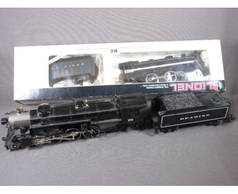 LIONEL ELECTRIC TRAINS O'GAUGE - a boxed Grand Trunk Western 4-4-2 locomotive intender No 8615 and a further unboxed model wi