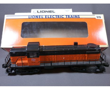 LIONEL ELECTRIC TRAINS O'GAUGE - a boxed Milwaukee Road R8-3 diesel engine in orange and black livery