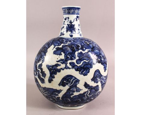 A CHINESE BLUE AND WHITE PORCELAIN MOON FLASK VASE, decorated with dragons amongst stylised waves, 29.5cm high, approx. 22cm 