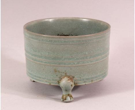 A CHINESE CELADON TRIPOD PORCELAIN CENSER - the body with a celadon glaze and three feet, 13cm