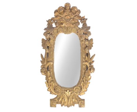 A rare late 17th / 18th Century Italian antique Rococo giltwood wall or console mirror having triple cherub carved top profus
